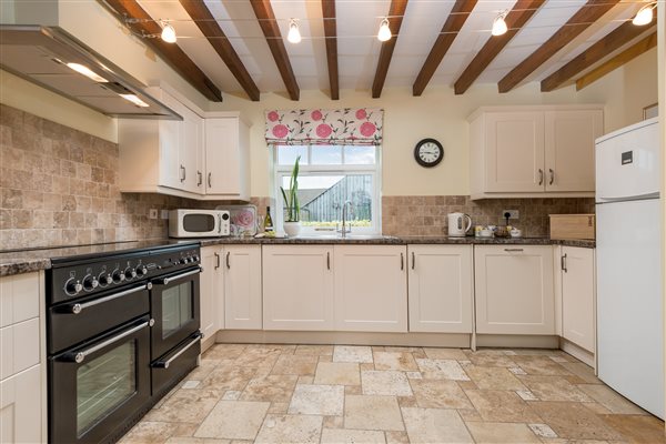 cream kitchen with black range oven